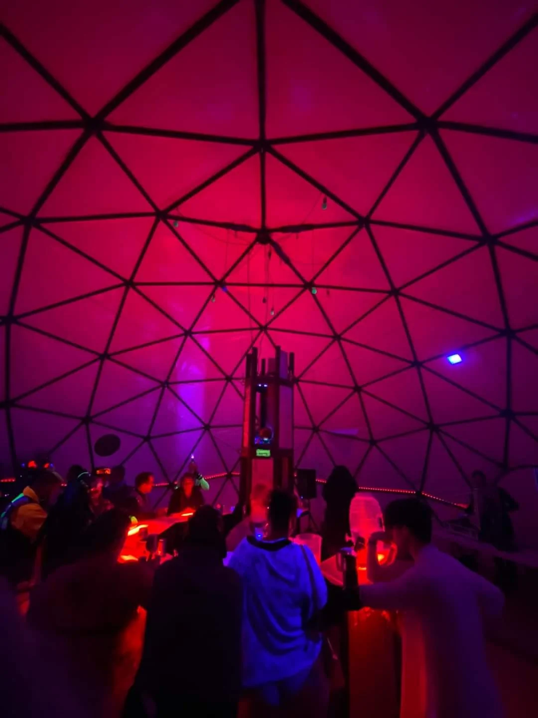 The geodesic event dome illuminated in magenta